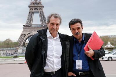 epa06671907 RMC-BFMTV French journalist Jean-Jacques Bourdin (L) and Mediapart French journalist Edwy Plenel (R) pose in front of the Eiffel Tower as they arrive for an interview the French President Emmanuel Macron at the Theatre national de Chaillot in Paris, 15 April 2018. Macron releases the interview after United States, Britain and France decided to launch air strikes in Syria in response to a suspected chemical weapons attack on 14 April 2018.  EPA/FRANCOIS GUILLOT / POOL