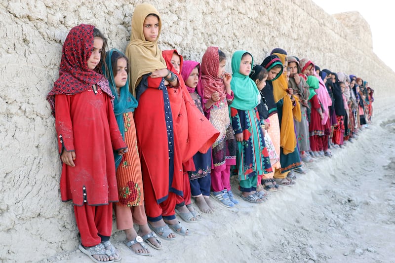 Afghan children attend an educational event organised by Pen Path, a civil society initiative providing education to Afghan children in areas where there is no school, in Kandahar, Afghanistan.