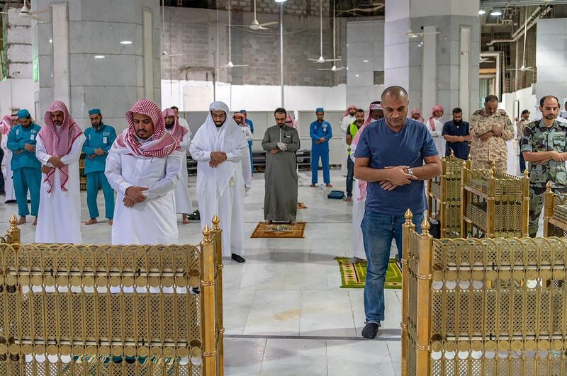 People perform prayer near the Kaaba in the Grand Mosque in Makkah, Saudi Arabia.  Reuters