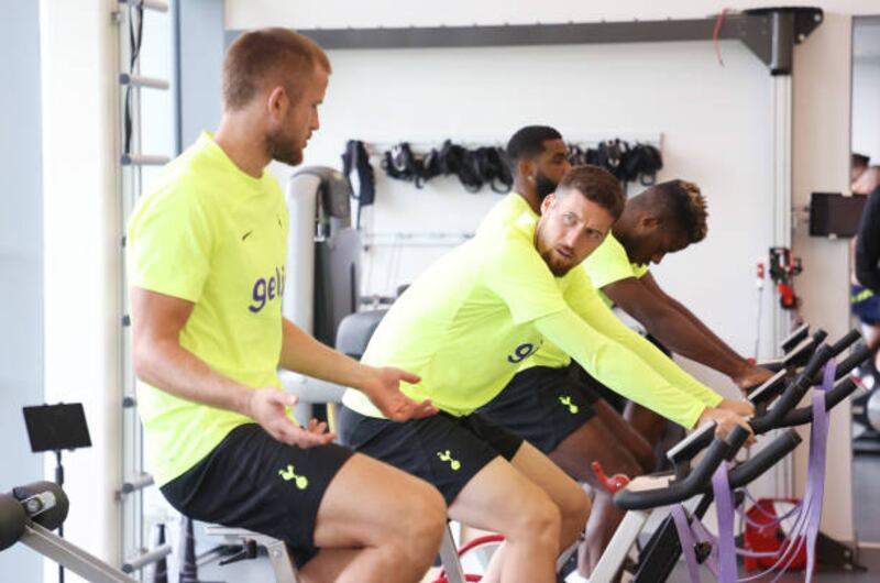 Matt Doherty and Eric Dier on exercise bikes. Getty Images