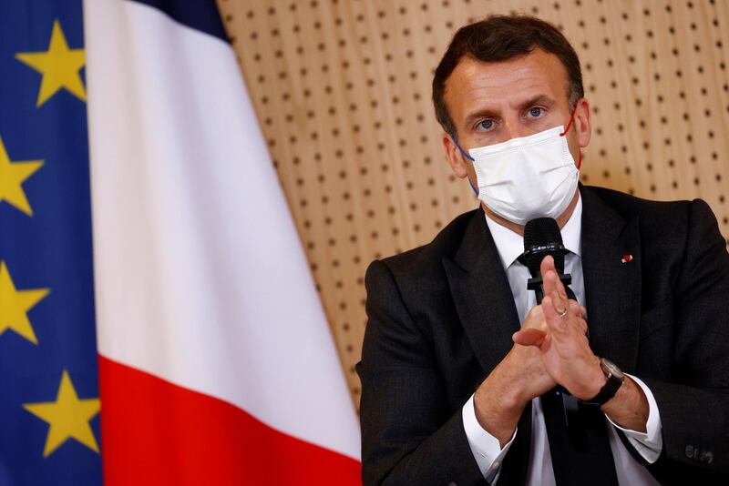 epa09135362 French President Emmanuel Macron, wearing a protective face mask, talks during a meeting with medical staff members during a visit in a child psychiatry department at Reims hospital to discuss the psychological impact of the COVID-19 crisis and the lockdown on children and teenagers in France, 14 April 2021.  EPA/CHRISTIAN HARTMANN / POOL  MAXPPP OUT