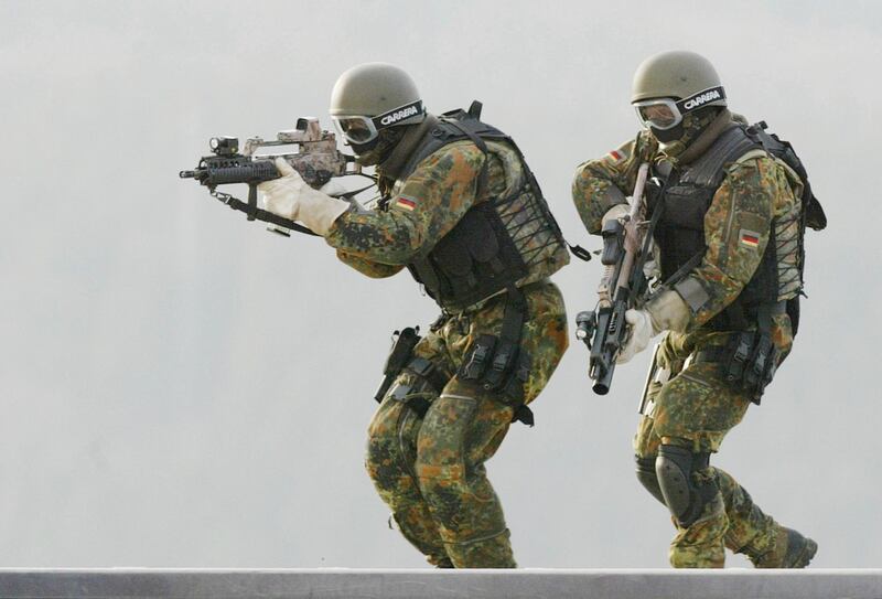 FILE  - In this Feb. 5, 2004 file photo, soldiers of (KSK) Kommando Spezialkraefte, German Bundeswehr's special forces take part in a training  exercise in Calw, southern Germany. Germanyâ€™s defense minister reportedly plans to restructure the countryâ€™s special forces unit after numerous allegations of far-right extremism. Defense Minister Annegret Kramp-Karrenbauer has called a press conference for Wednesday, July 1, 2020 to talk about a â€œstructural analysisâ€ of the KSK, unit, following up on an analysis she ordered in May. (AP Photo/Thomas Kienzle, File)