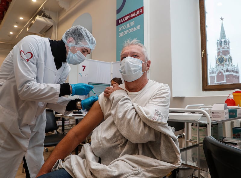 A man receives a shot of Russia's Sputnik V vaccine in Moscow. EPA