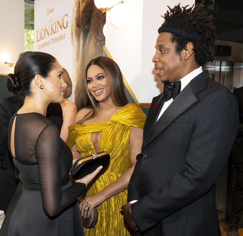 LONDON, ENGLAND - JULY 14: Meghan, Duchess of Sussex (L) meets cast and crew, including Beyonce Knowles-Carter (C) Jay-Z (R) as she attends the European Premiere of Disney's "The Lion King" at Odeon Luxe Leicester Square on July 14, 2019 in London, England.  (Photo by Niklas Halle'n-WPA Pool/Getty Images)