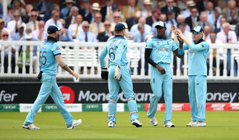 England's Jofra Archer (centre) celebrates catching out Australia's Steve Smith with team mate Eoin Morgan (right) during the ICC Cricket World Cup group stage match at Lord's, London. PRESS ASSOCIATION Photo. Picture date: Tuesday June 25, 2019. See PA story CRICKET England. Photo credit should read: Tim Goode/PA Wire. RESTRICTIONS: Editorial use only. No commercial use. Still image use only.