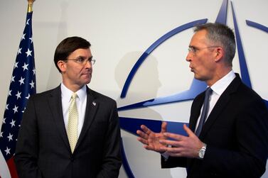 Nato Secretary General Jens Stoltenberg, right, and US Secretary for Defence Mark Esper participate in a media conference in Brussels AP