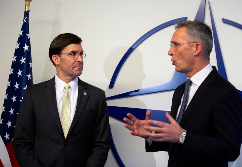 NATO Secretary General Jens Stoltenberg, right, and U.S. Secretary for Defense Mark Esper participate in a media conference prior to a meeting of NATO defense ministers at NATO headquarters in Brussels, Wednesday, Feb. 12, 2020. NATO ministers, in a two-day meeting, will discuss building stability in the Middle East, the Alliance's support for Afghanistan and challenges posed by Russia's missile systems. (AP Photo/Virginia Mayo, Pool)
