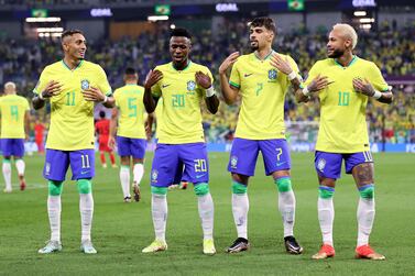 Vinicius Junior of Brazil (2L) celebrates Raphinha (L), Lucas Paqueta (2R) and Neymar (R) after scoring the 1-0 during the FIFA World Cup 2022 round of 16 soccer match between Brazil and South Korea at Stadium 974 in Doha, Qatar, 05 December 2022.   EPA / Abedin Taherkenareh