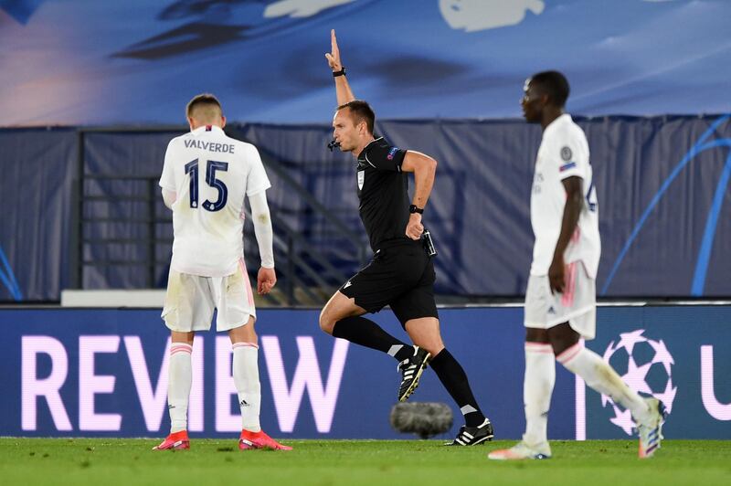 Referee Srdjan Jovanovic rules out a Real Madrid goal after checking VAR. Getty