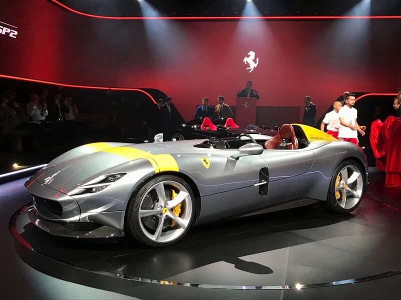 The Ferrari Monza SP1 is displayed in Maranello, Italy, Tuesday, Sept. 18, 2018. Sportscar maker Ferrari has unveiled two updated versions of its classic open-top "barchetta" racing model as it briefs investors on a new five-year business plan. Nicolo Boari, the head of product marketing, said Tuesday that the Ferrari Monza SP1 and SP2 are "the most powerful ever in Ferrari history," with an 810 horsepower engine able to reach 100 kilometers per hour (62 mph) in 2.9 seconds. (AP Photo/Collen Barry)