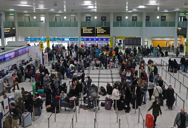 Passengers wait around in the terminal building at Gatwick Airport after drones flying illegally over the airfield forced the clossure of the airport, in Gatwick, Britain, December 20, 2018. REUTERS/Peter Nicholls