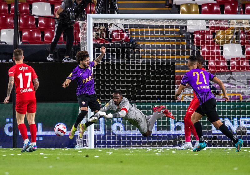 Shabab Al Ahli goalkeeper Majed Naser saves the ball.  