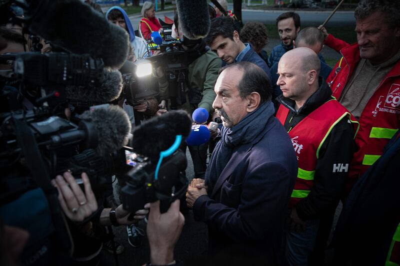 CGT union leader Philippe Martinez talks to the media as he greets striking workers at the Gravenchon Port-Jerome refinery, northern France. AFP