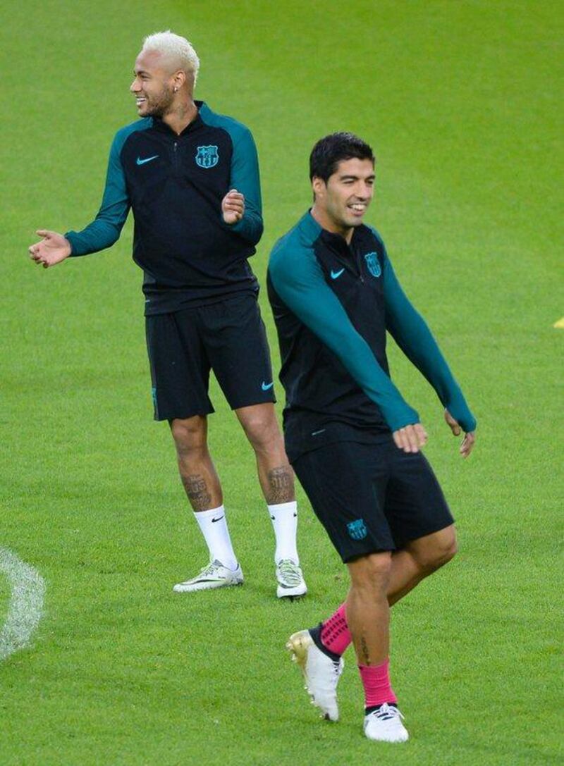 Barcelona players Neymar, left, and Luis Suarez attend a training session in Monchengladbach. Roberto Pfeil / AFP
