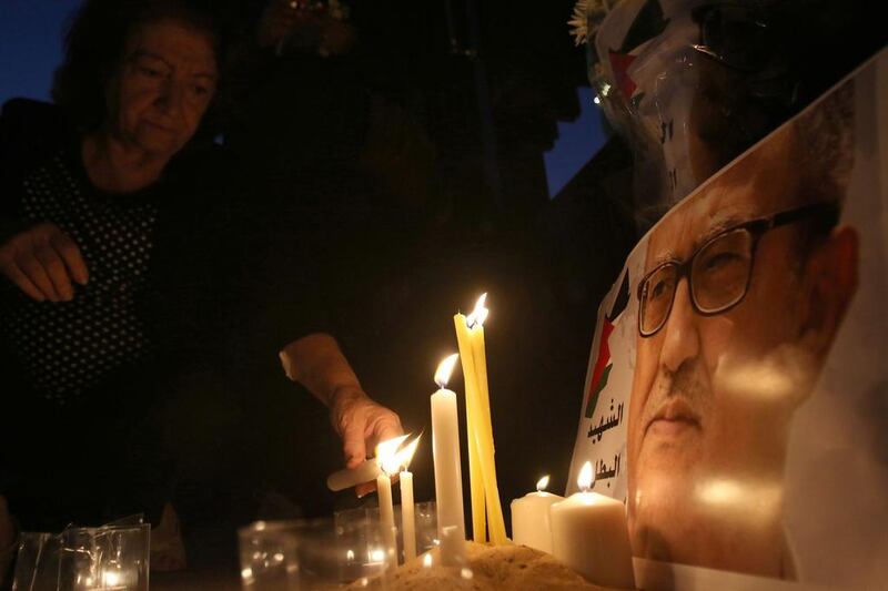 Jordanians light candles for Nahed Hattar during a vigil at the site where he was killed on September 26, 2016. Khalil Mazraawi/AFP 