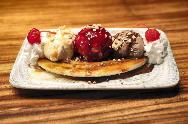 DUBAI, UNITED ARAB EMIRATES , September 27 – 2020 :-  80’s Banana split dish at the Brass Monkey, new dining and entertainment destination on the Bluewaters Island in Dubai.  (Pawan Singh / The National) For Lifestyle/Online/Instagram. Story by Janice Rodrigues 