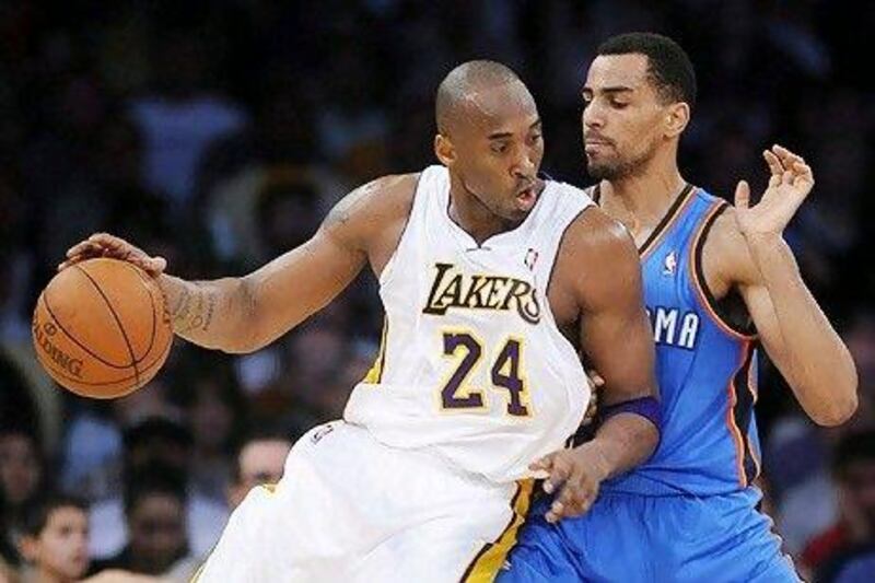Thabo Sefolosha, right, could not stop Kobe Bryant from scoring 38 points to grab the league scoring title from Sefolosha's Oklahoma City Thunder teammate, Kevin Durant.