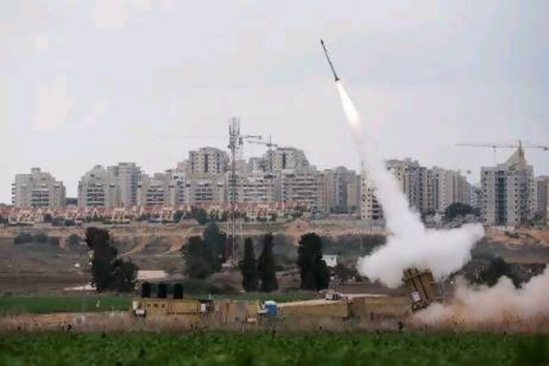 An Iron Dome launcher fires an interceptor missile near the Israeli city of Ashkelon yesterday, as Israel bombs Palestinian targets in the Gaza Strip from air and sea for a fifth straight day.