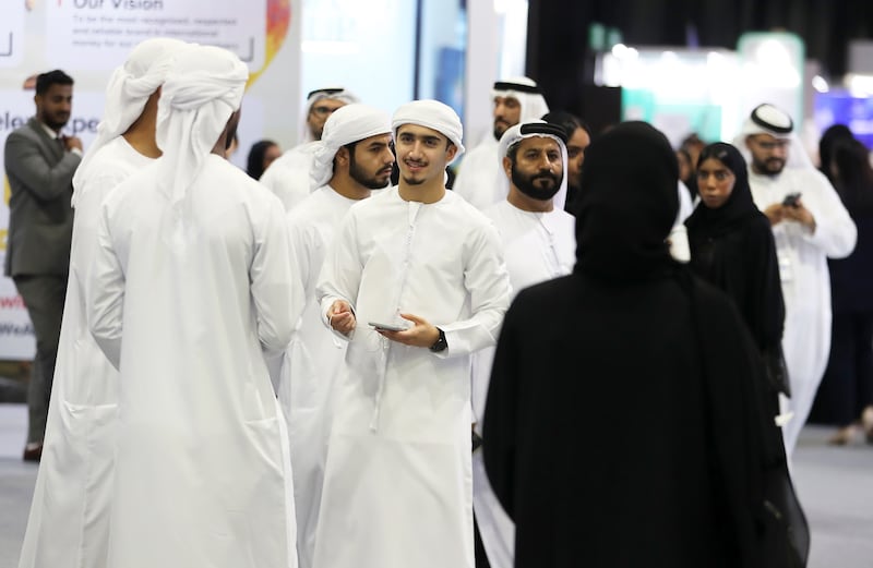 Emirati jobseekers at the Ru'ya 2023 Careers UAE Redefined event at Dubai World Trade Centre last week. Pawan Singh / The National