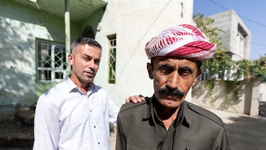 Farsat Omar, left, and Omar Ismail, relatives of Dimokrat, who was killed close to the Turkish-Iraqi border. Chris Whiteoak / The National