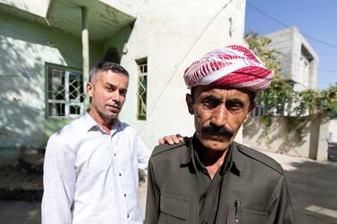 Farsat Omar, left, and Omar Ismail, relatives of Dimokrat, who was killed close to the Turkish-Iraqi border. Chris Whiteoak / The National