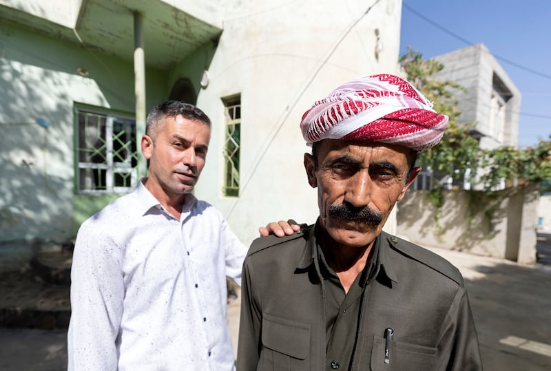 Farsat Omar, left, and Omar Ismail, relatives of Dimokrat, who was killed close to the Turkish-Iraqi border. Chris Whiteoak / The National