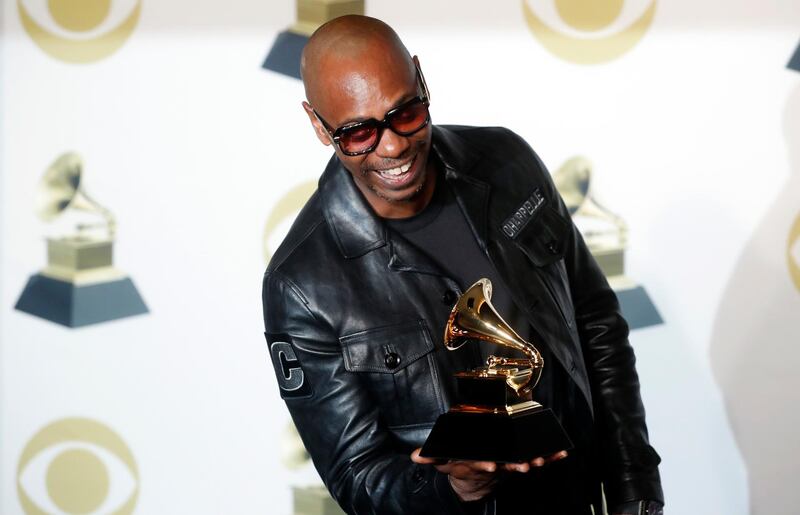 Dave Chappelle poses with his Grammy for Best Comedy Album for 'The Age Of Spin & Deep In The Heart Of Texas'. Reuters
