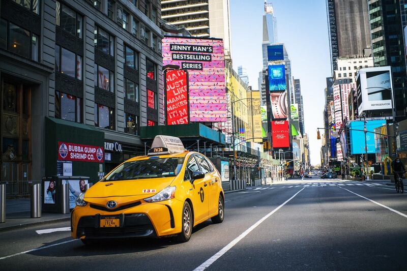 NEW YORK, NY - MARCH 26: A taxi drives down Times Square on March 26, 2020 in New York City. Most cabdrivers are fearful of being exposed to the coronavirus that they prefer to stay home with no way to pay bills, while across the country schools, businesses and places of work have either been shut down or are restricting hours of operation as health officials try to slow the spread of COVID-19.   Eduardo Munoz Alvarez/Getty Images/AFP (Photo by EDUARDO MUNOZ ALVAREZ / GETTY IMAGES NORTH AMERICA / Getty Images via AFP)