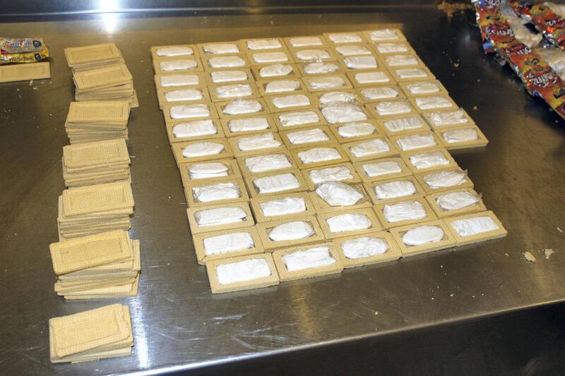 This April 2015 photo provided by U.S. Customs and Border Protection shows vanilla wafers filled with cocaine in Houston. A Guatemalan citizen arrived at George Bush Intercontinental Airport from Guatemala City in April with packages of vanilla wafers. But when customs officials opened them up, they said they found they were filled with cocaine instead of cream filling. He also had bags of chips that had small bundles of cocaine inside of them. The 4 pounds of cocaine had a street value of more than $60,000. (U.S. Customs and Border Protection via AP)