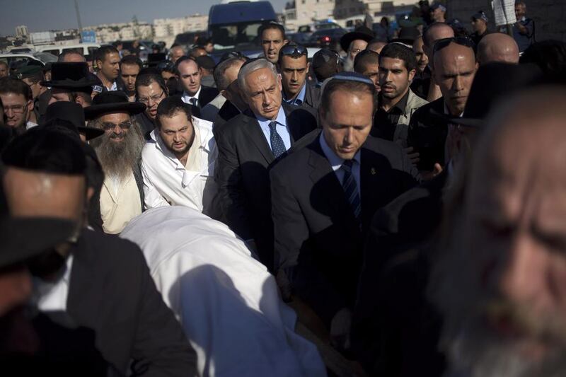 Benjamin Netanyahu, pictured attending a Jerusalem funeral yesterday, had attempted to reach out directly to young Iranians over the heads of their leaders. Ariel Schalit / AP

