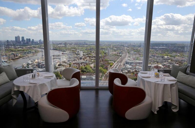 The Canary Wharf financial district can be seen from a restaurant at the Shangri-La Hotel at the Shard. Dan Kitwood / Getty Images