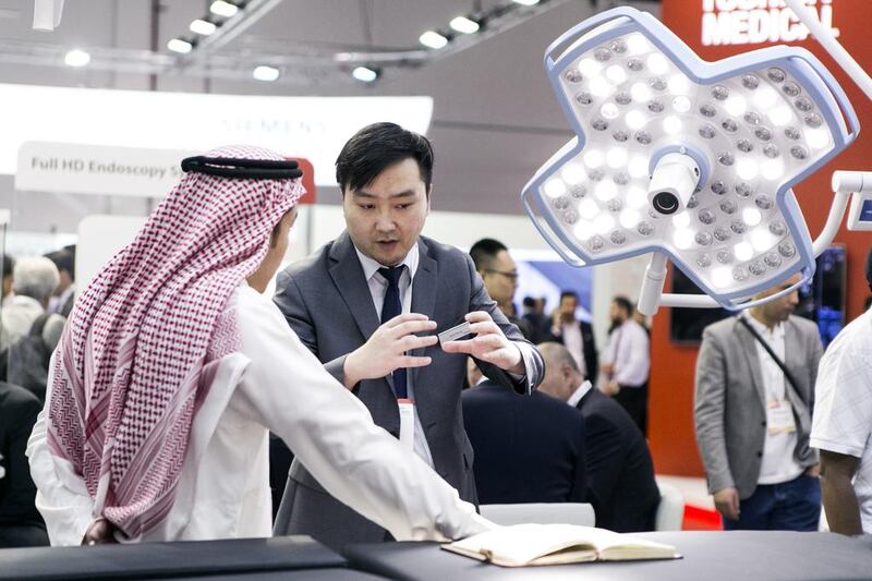 A visitor inspects an operating table at Toshiba Medical’s booth at the Arab Health Congress in Dubai this year. Reem Mohammed / The National