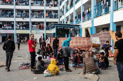 Injured Palestinians and their families take shelter in a UNRWA school. Getty Images