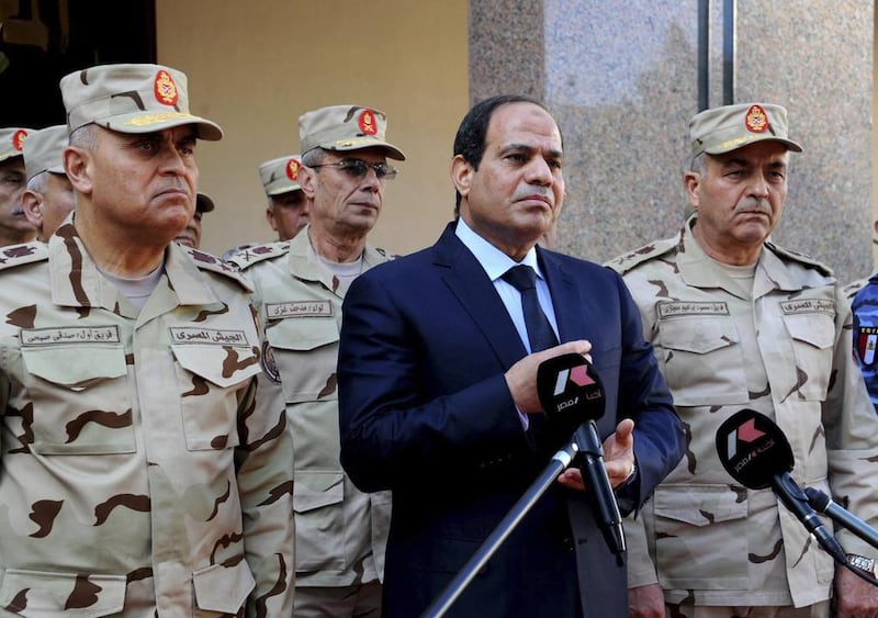 Egyptian president Abdel Fattah El Sisi, flanked by top military generals, talks to the media after an emergency meeting of the Supreme Council of the Armed Forces in Cairo, on January 31, 2015. The Egyptian Presidency/Handout via Reuters 