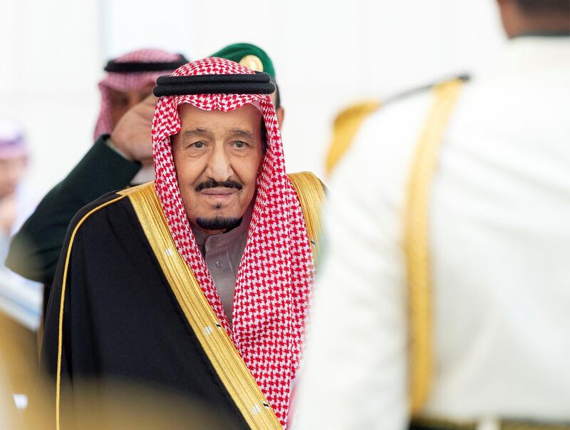 King Salman arrives to address the Shura Council. Saudi Royal Court / Reuters