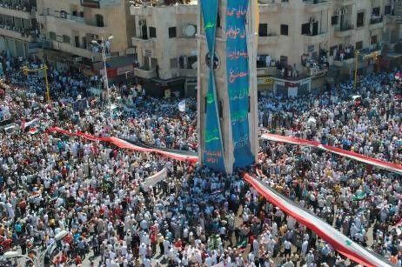 Protesters demonstrate against the Syrian government in July 2011. Regime and rebels alike have used the flag to powerful effect. AFP