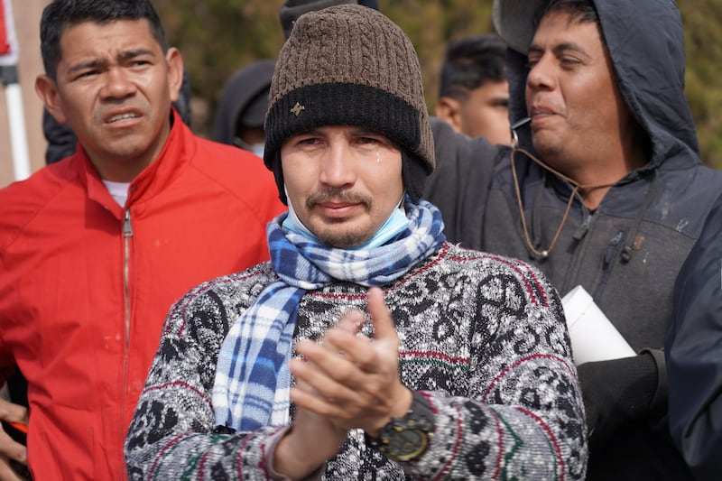 A migrant cheers on protesters during a march against Title 42. Willy Lowry / The National