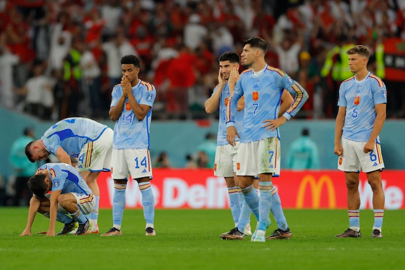 Dejected Spain players after the match. AFP