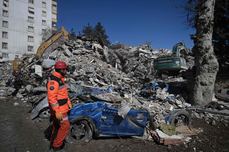A rescuer stands near the site where Aleyna Olmez, 17, was rescued from the rubble of a collapsed building in Kahramanmaras, about 10 days after the quake struck. AFP