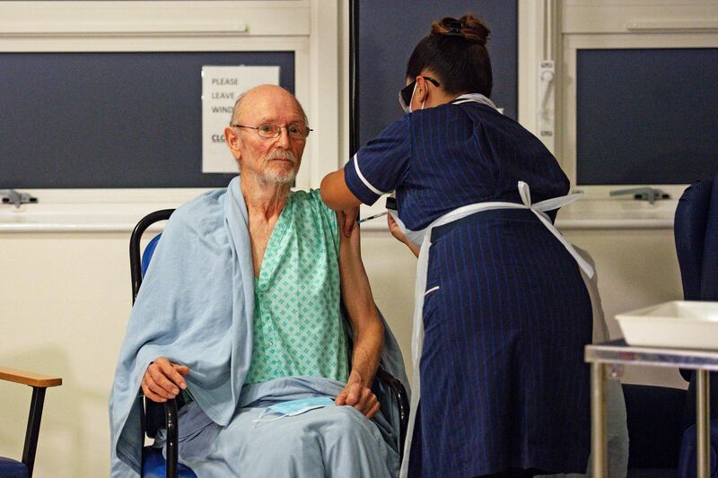 "Bill" William Shakespeare, 81, receives the Pfizer-BioNTech Covid-19 vaccine, at University Hospital, Coventry. AP Photo