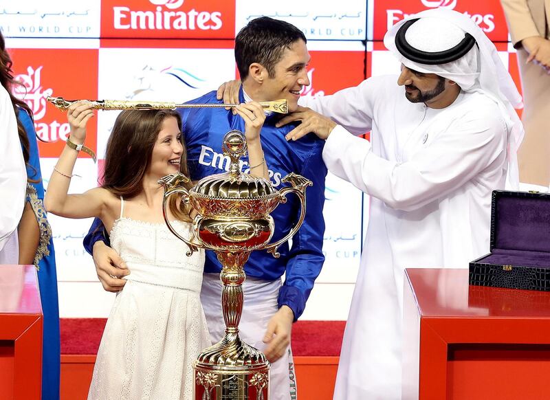 Dubai, United Arab Emirates - March 31st, 2018: Presentation to Christophe Soumillion (blue) with HH Sheikh Hamdan bin Mohammed bin Rashid Al Maktoum as Thunder Snow wins the Dubai World Cup at the Dubai World Cup raceday 2018. Saturday, March 31st, 2018 at Meydan Race Course, Dubai. Chris Whiteoak / The National