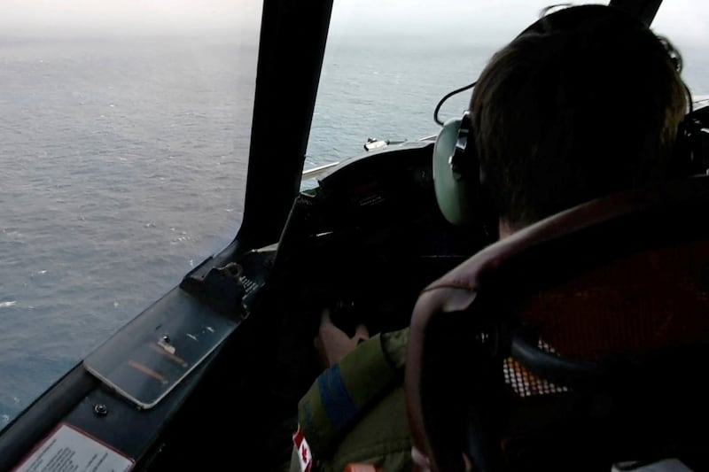 The pilot of a Royal Canadian Air Force maritime surveillance aircraft flies over the Atlantic during the search for the missing OceanGate submersible. Reuters