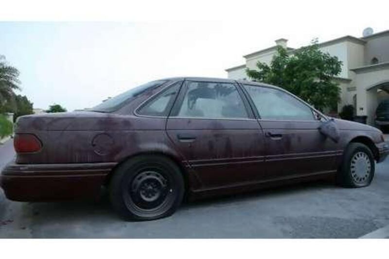 An abandoned car in Dubai's Springs Village.