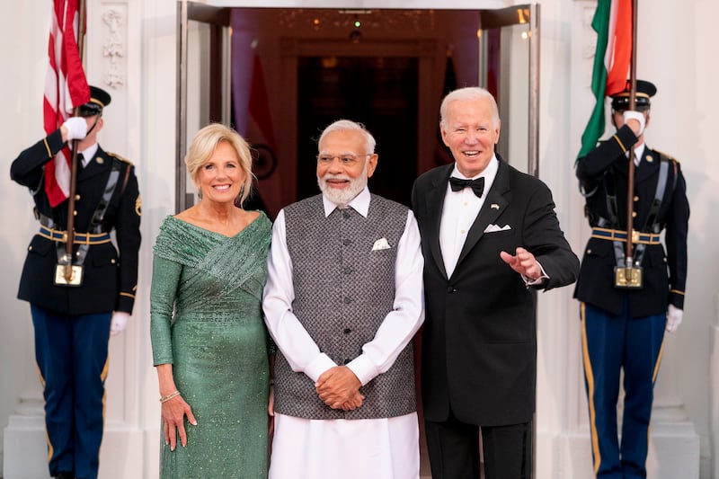 The Bidens and Mr Modi arrive for a state dinner. AP