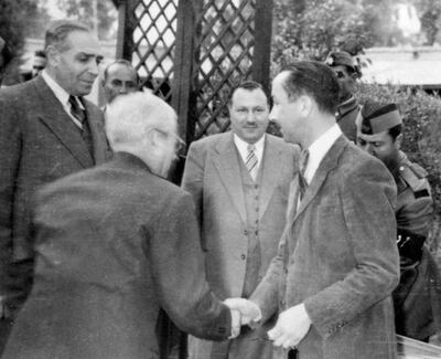 L-R: Abdul Jabbar Al Rawi, Abdul Majid Mahmoud, both members of the parliament of the Arab Federation of Iraq and Jordan, and Prince Abdulilah the regent (far right), in 1958 