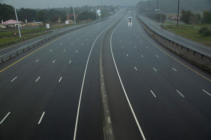 A car drives along a motorway in Johannesburg, South Africa, Saturday, April 4, 2020. South Africa went into a nationwide lockdown for 21 days in an effort to control the spread of the coronavirus. The new coronavirus causes mild or moderate symptoms for most people, but for some, especially older adults and people with existing health problems, it can cause more severe illness or death. (AP Photo/Themba Hadebe)