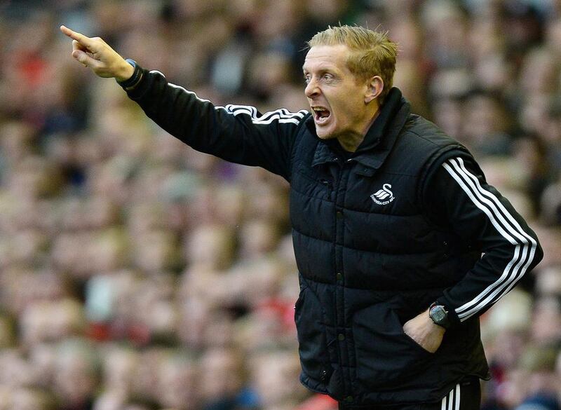Swansea City have rewarded manager Garry Monk for keeping the side in the Premier League by naming him as their permanent manager on a three-year deal, the club said on May 7, 2014.  EPA/PETER POWELL
