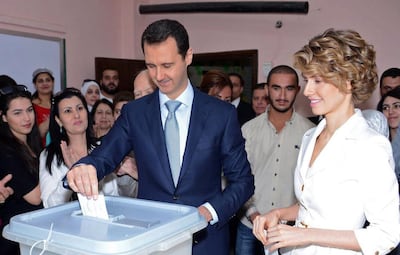 Some observers point to the ascendancy of Bashar Al Assad’s wife Asma, right, and that she might be cleaning house. AFP