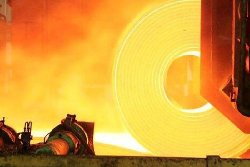 Red hot steel is rolled into coils at the Arcelor Brasil SA steel. (Rich Press/Bloomberg News)