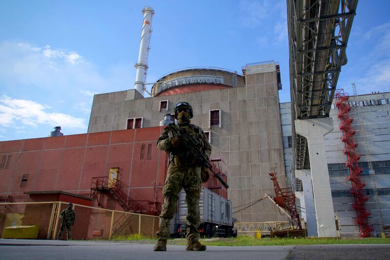 A Russian serviceman on guard outside Zaporizhzhia nuclear power station in May 2022. AFP